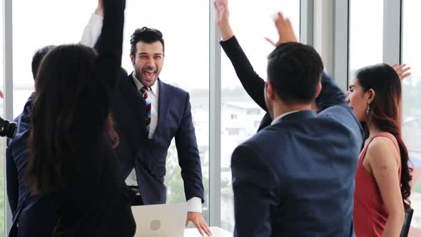 Confident businessman present Company Growth Data with Graphs to member in meeting alt