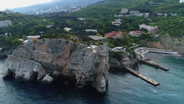 Aerial. Rocky Sea Shore in Crimea, Yalta. Coastal Urban Town Houses and Swallow Nest Landmark alt