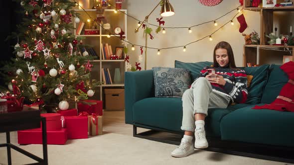 Woman Using Mobile Phone Closeup alt