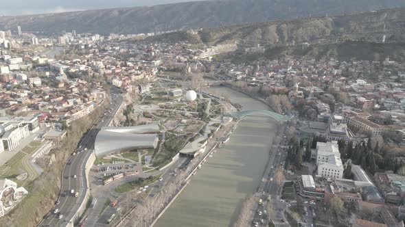 Aerial view of Tbilisi city central park and Bridge of Peace. Beautiful cityscape of old Tbilisi alt