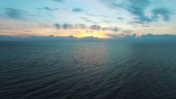 Aerial Flight Over Sea at Sunset