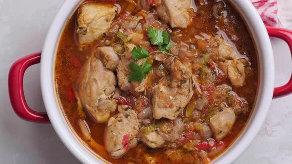 Chicken Stew with Tomato Sauce in Pot Top View alt