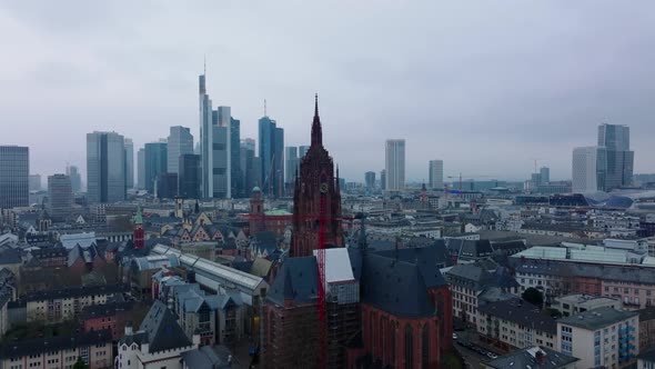 Forwards Fly Above Buildings in Urban Borough Around Tower of Frankfurter Dom alt