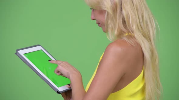 Young Beautiful Blonde Woman Using Digital Tablet