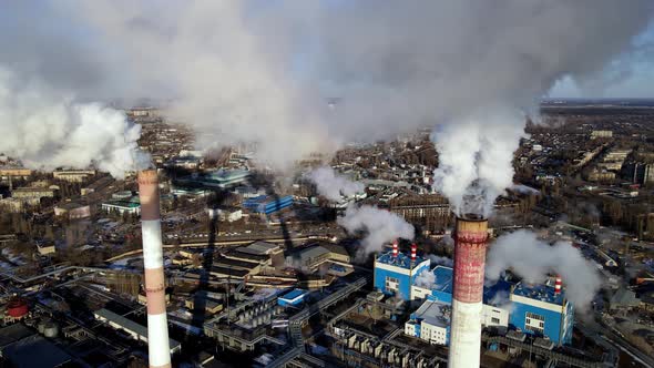 Industrial factory emissions of carbon gases with smoke in atmosphere alt