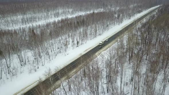 Cars And Bus On The Winter Country Road alt