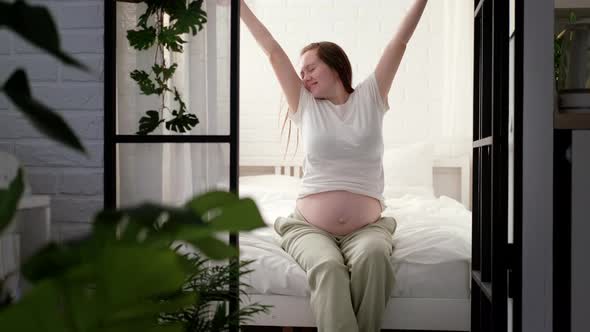 Pregnant Happy Morning Expectant Mother Wake Up Caressing Her Belly alt