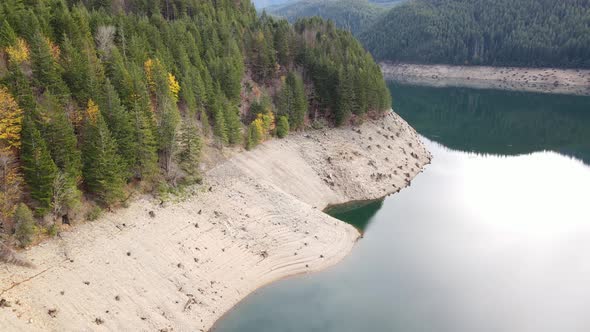 Aerial shot of a reservoir with low water levels alt