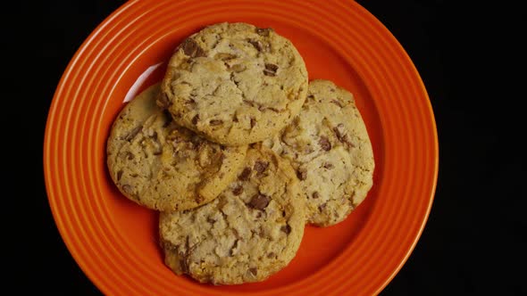 Cinematic, Rotating Shot of Cookies on a Plate  alt