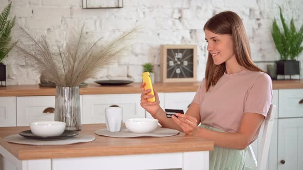 Female Pays for the Purchase at Home