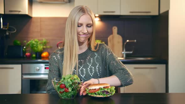 Young Lady Preferring Salad To Hamburger alt