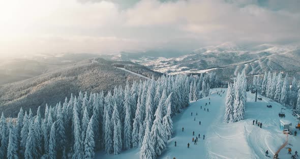 Sunny Day on Winter Snowy Mountain Holiday Resort with Tourists Ski in Bukovel Ukraine