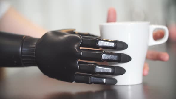 Adaptation, Young Girl Learning To Hold a Cup of Tea alt