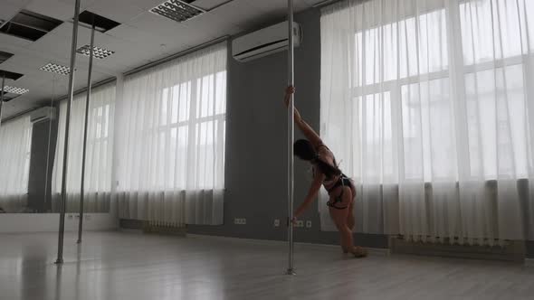 Fit Woman Dancing Erotic Dance in Studio