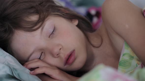 Little girl sleeping in morning light