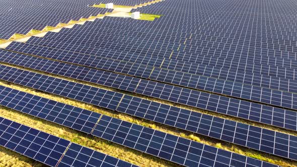 Aerial Drone View Flight Over Solar Power Station Panels alt