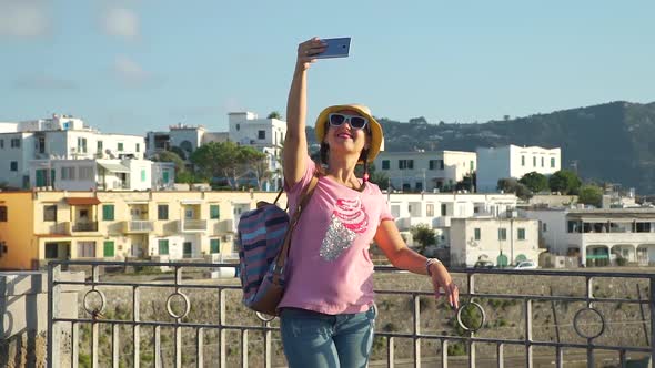 Woman Taking Photos with Smart Phone in Vacation alt