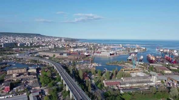 Bridge with Cars Passes Over Strait of Black Sea in City of Varna with Hotels and Parks alt
