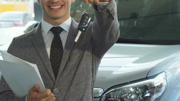 A Representative Seller Holds the Keys To a New Car