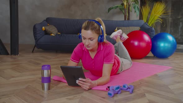 Sporty Fit Female Chatting Online with Fitness Instructor alt