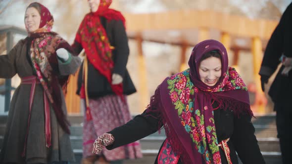 Russian Folklore - Man Is Clapping To Women in Scarves Who Smiling and Laughing alt