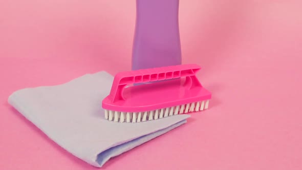 Closeup of a Plastic Jar of Cleaning Agent a Cleaning Cloth and a Brush