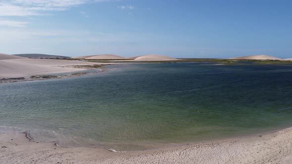 Jericoacoara Ceara Brazil. Scenic sand dunes and turquoise rainwater lakes alt