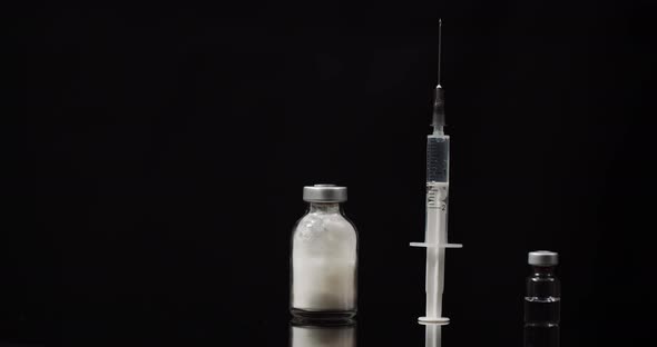 Syringe and Medicine on Black Background Isolated alt