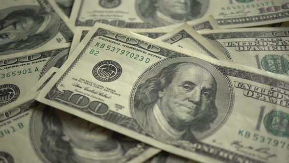 100 Dollar Bills On Table Isolated On Chroma Key Green Screen Background alt