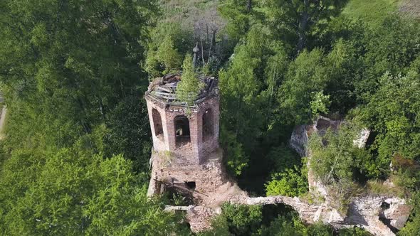 Flying over ruins of the ancient stony church alt