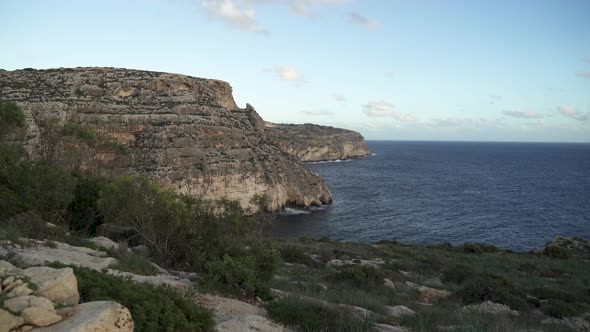 Greenery Grows on Top of Babu Valley near Blue Grotto Sea Caves in Malta alt