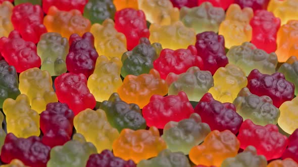 Full Frame Looped Spinning Background of Colorful Jelly Bear Candies