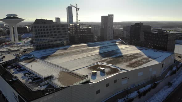 Drone flying upwards towards Hyllie, Emporia. Malmö Arena, Sweden, wintertime alt