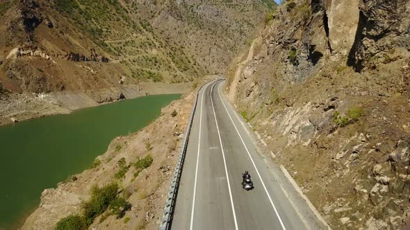 Motorbike Rider, Riding with River View of Ardahan Canyon, Turkey