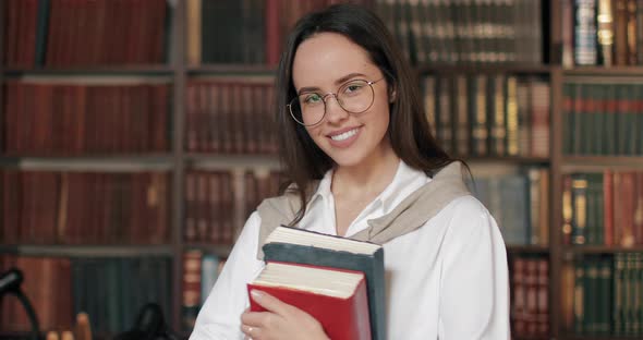 Portrait of Smiling Girl in Library alt