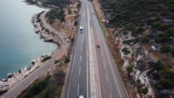 Cars Drive Highway Along Sea Coast Evening alt