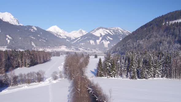 Aerial Rural Landscape With Mountains in Winter alt