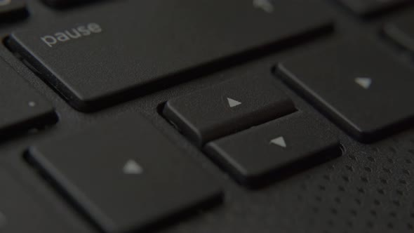 The Finger Presses the Down Button on the Keyboard alt