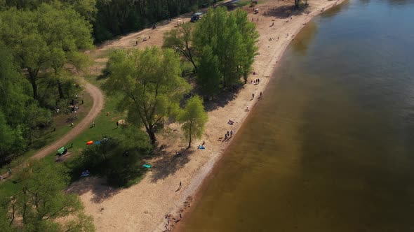 Top View of a Group of Friends Playing Beach Volleyball on the Beach alt