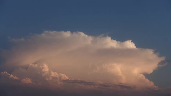 Clouds in the sky during sunset. Time lapse. alt