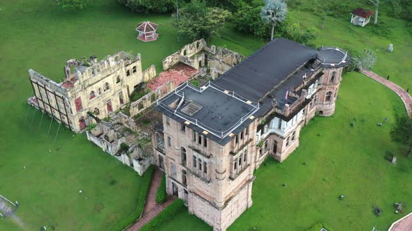 Drone fly around historic moorish revival Kellie's castle next to Raya river, capturing exterior det alt