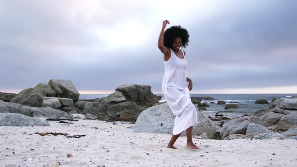 Woman dancing on the beach 4k