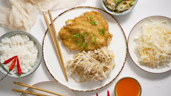 Thai Style Fried Crispy Chicken Breast in Breadcrumbs Served with Rice Noodles