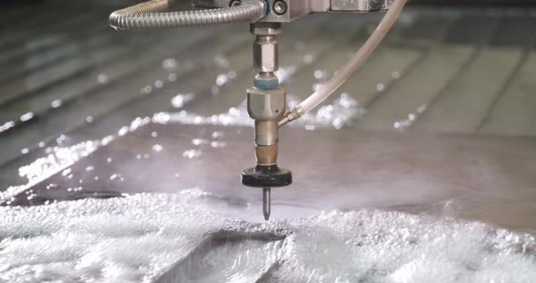 Waterjet High Pressure CNC Machine is Cutting Out a Holes on a Metal Sheet