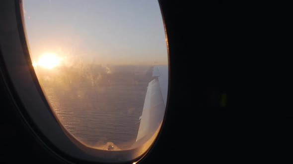 View From the Window of a Passenger Plane to the Sea Ocean