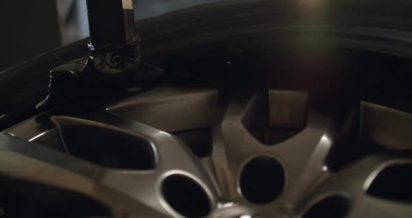 Close Process of Removing a Tire From an Alloy Wheel with a Tire Changer alt