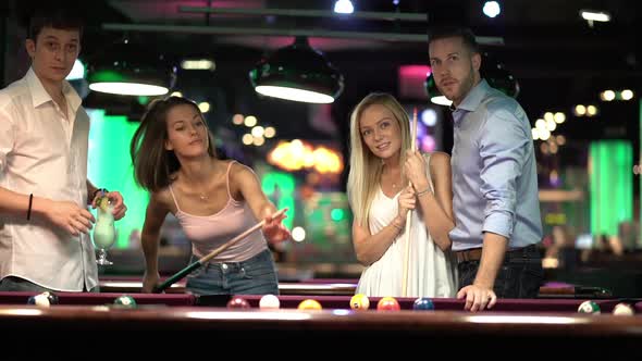Friends Playing Billiard Together