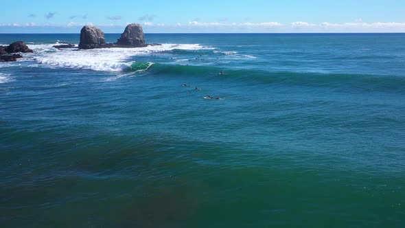 surfing in punta de lobos chile sunny day incredible landscape recorded with drone alt
