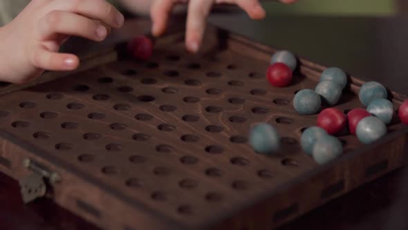 Board Game with Red and Blue Balls on the Playing Field alt
