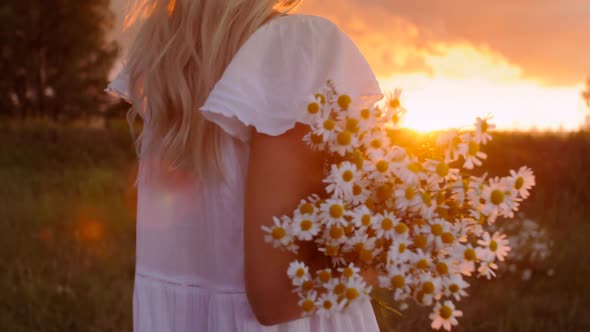 Girl With Flowers at Sunset